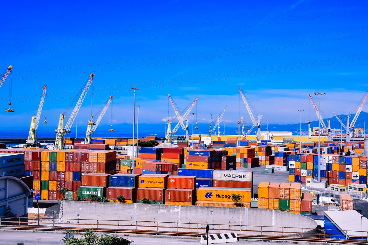 Containers stacked at a busy port