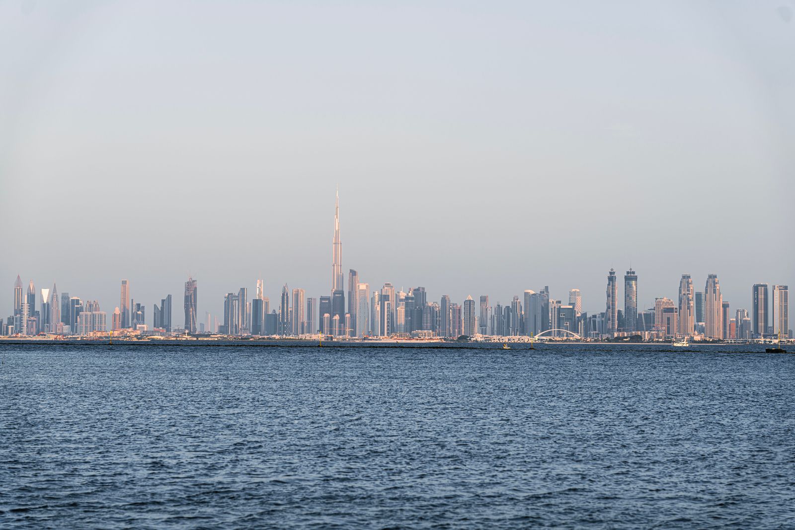Dubai skyline across the water with Burj Khalifa