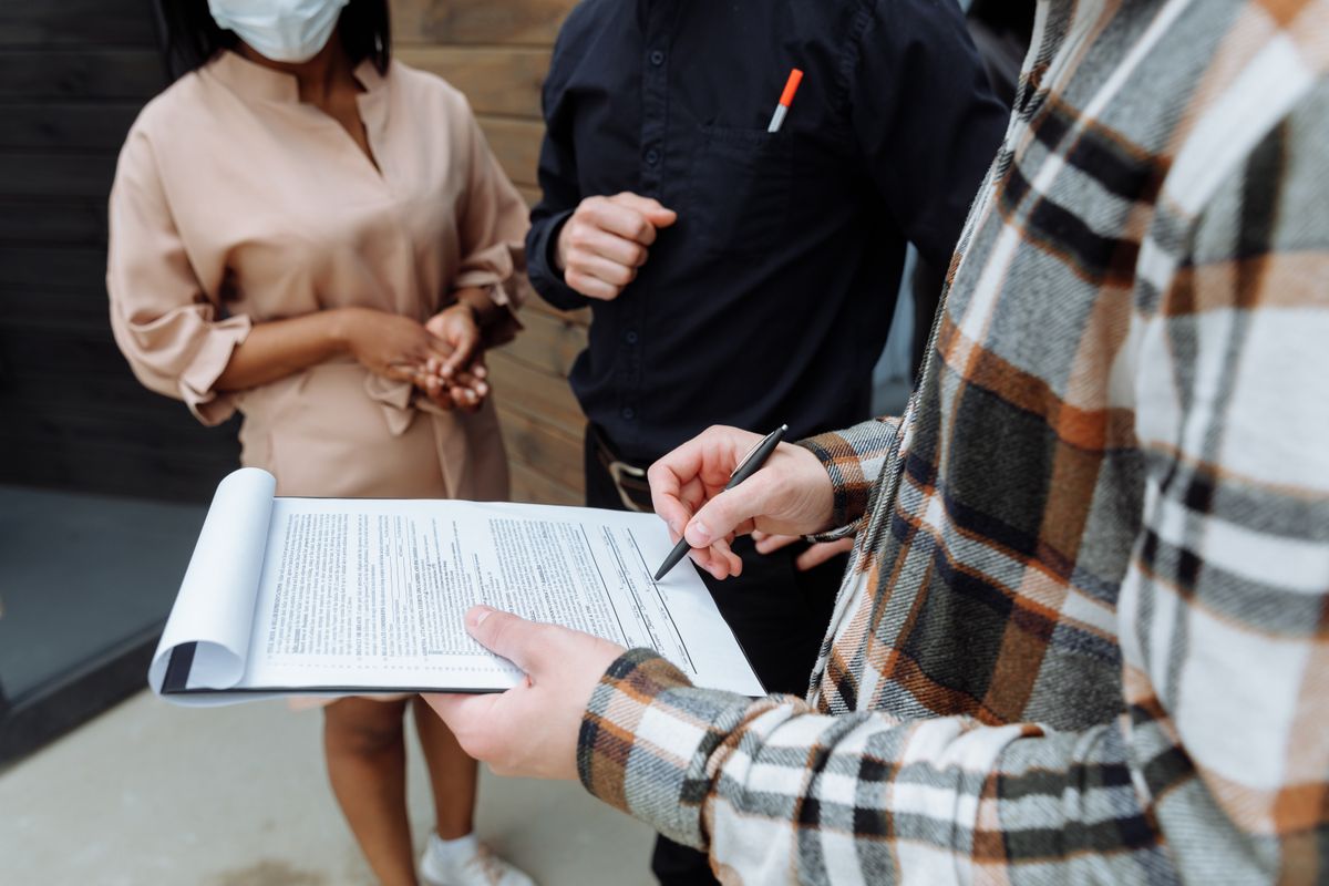Hands going over a document together